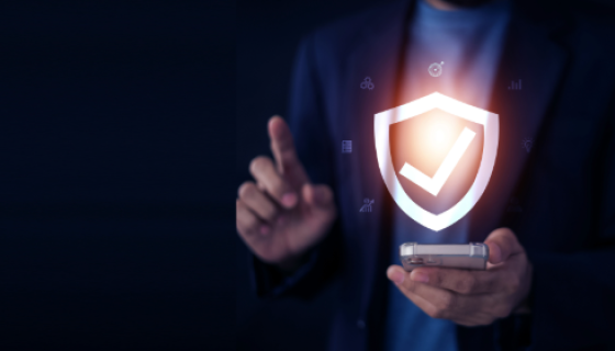 A cyber themed image of a person holding a phone and a cyber tick above it