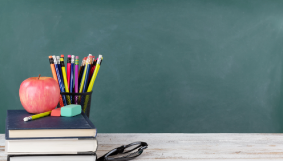 An image of books and pencils