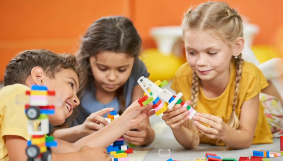An image of children playing with blocks