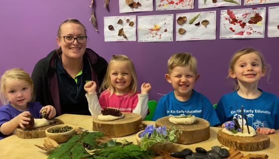 Sandra Trimper, Director Kin Kin Early Education, at a table with four children playing with natural objects